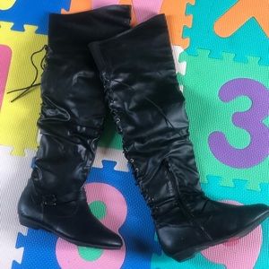 Black knee high boots. New, never worn.